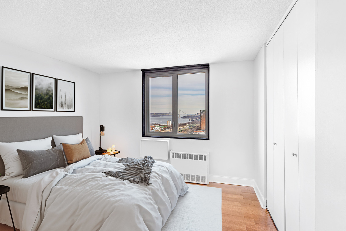 3333 Broadway, Unit E4C Manhattan, NY 10031 - Photo 7 of 23 a bedroom with a bed and a window