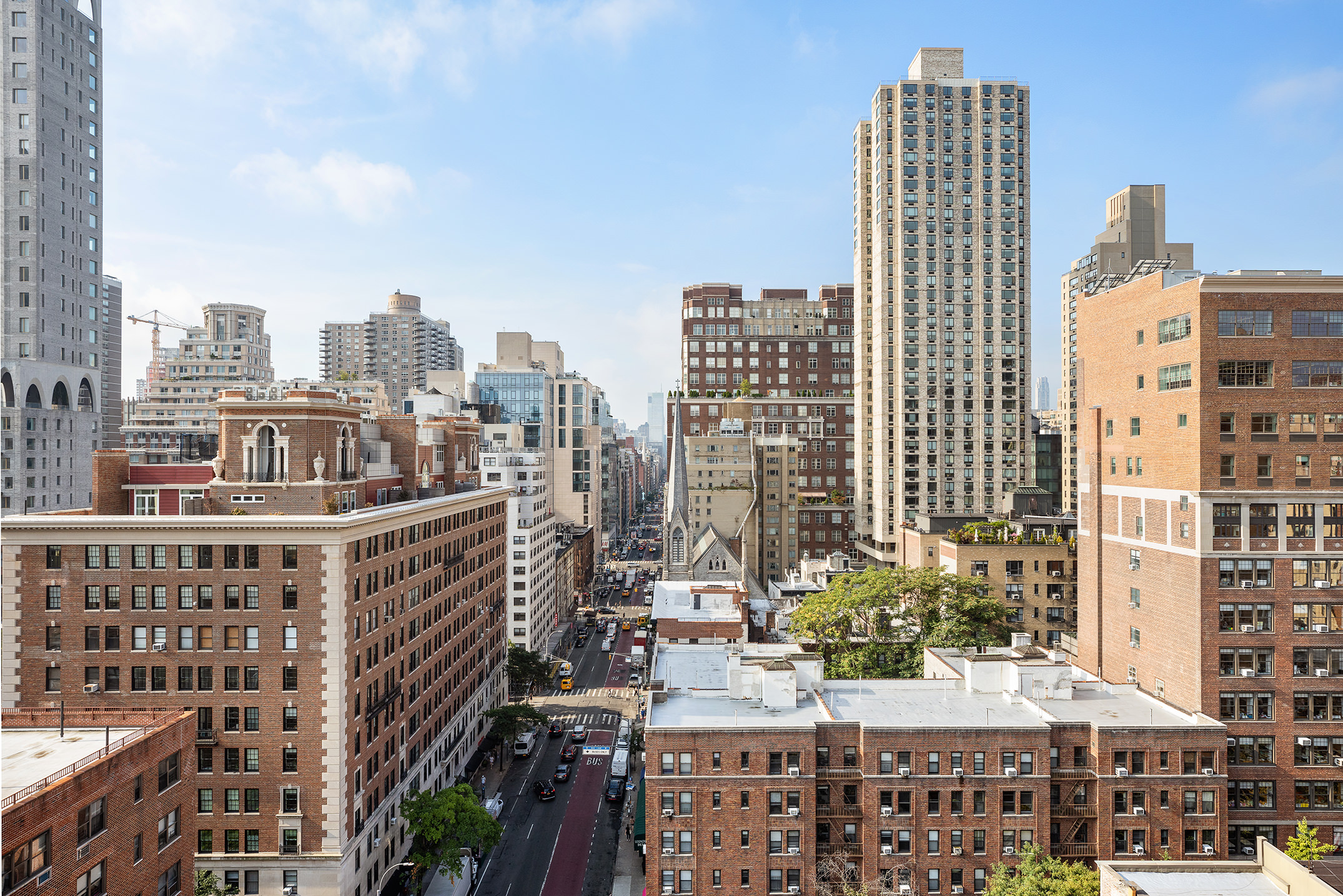 120 East 90th Street, Unit 16E Manhattan, NY 10128 - Photo 6 of 15 a city view with tall buildings