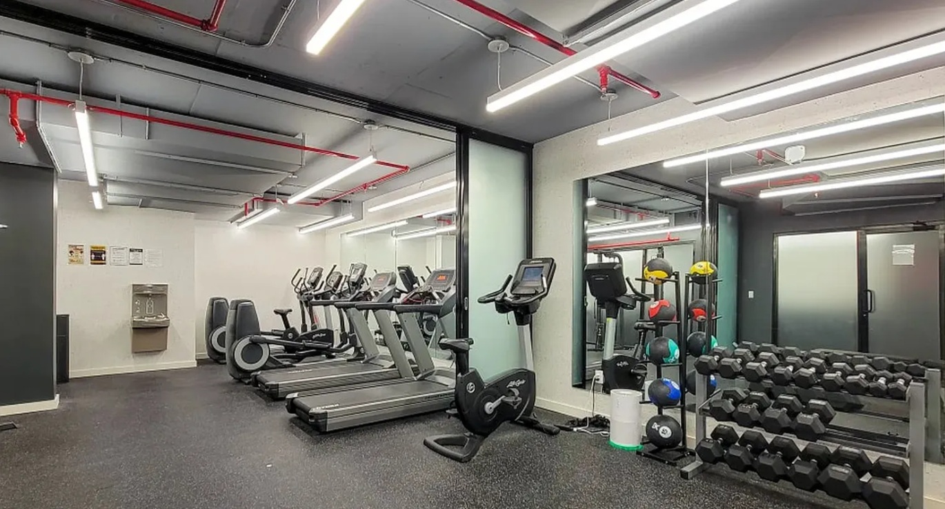 1330 5th Avenue, Unit 6H Manhattan, NY 10026 - Photo 10 of 11 a view of a room with gym equipment