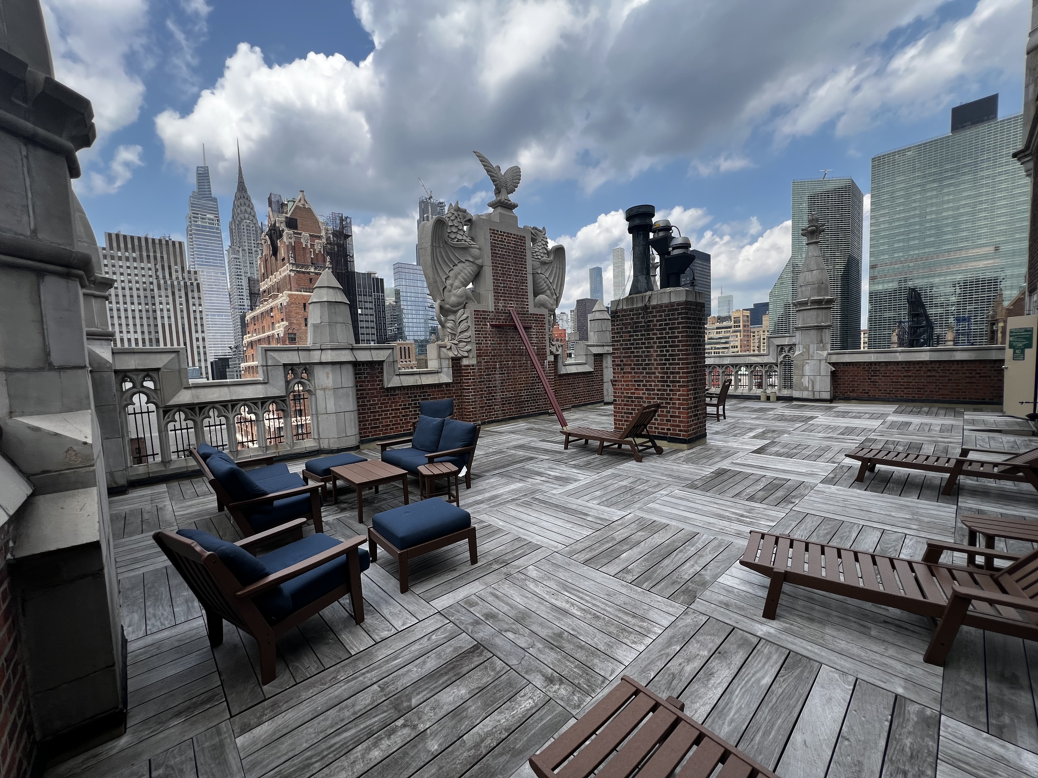 25 Tudor City Place, Unit 1202 Manhattan, NY 10017 - Photo 15 of 19 a living room with furniture and wooden floor