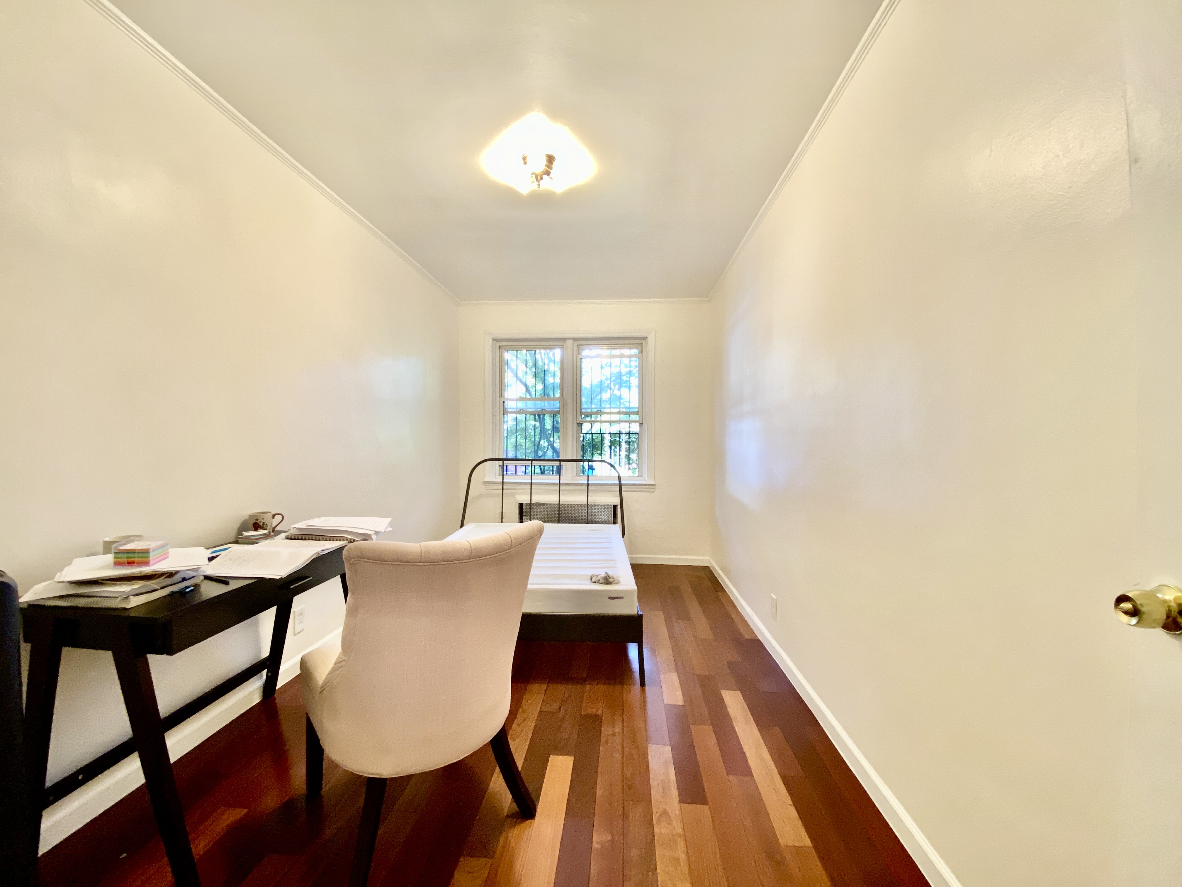156 96th Street, Unit 1 Brooklyn, NY 11209 - Photo 5 of 7 a view of a workspace with furniture and wooden floor