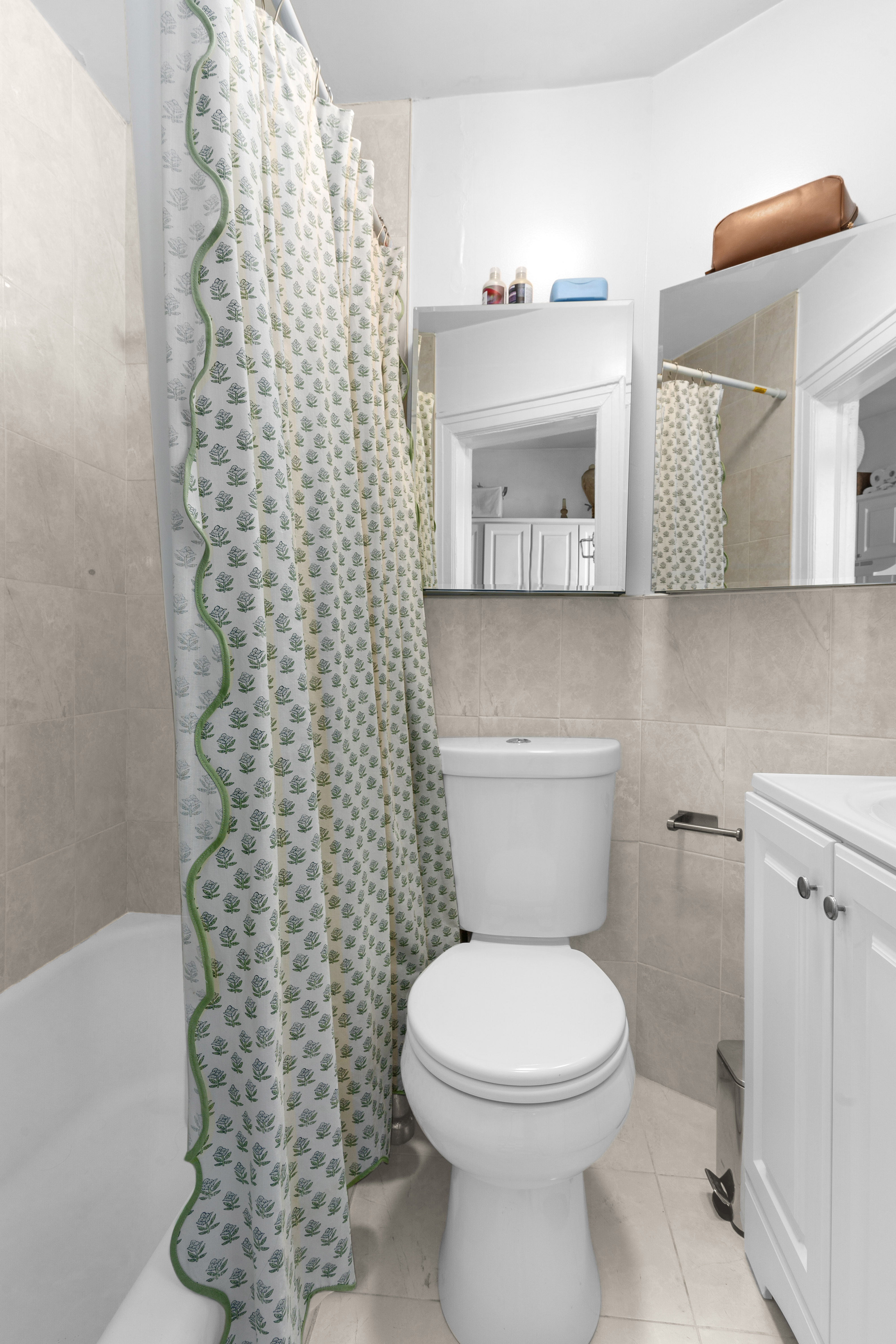 139 North 8th Street Brooklyn, NY 11249 - Photo 10 of 15 a bathroom with a toilet and a shower curtain