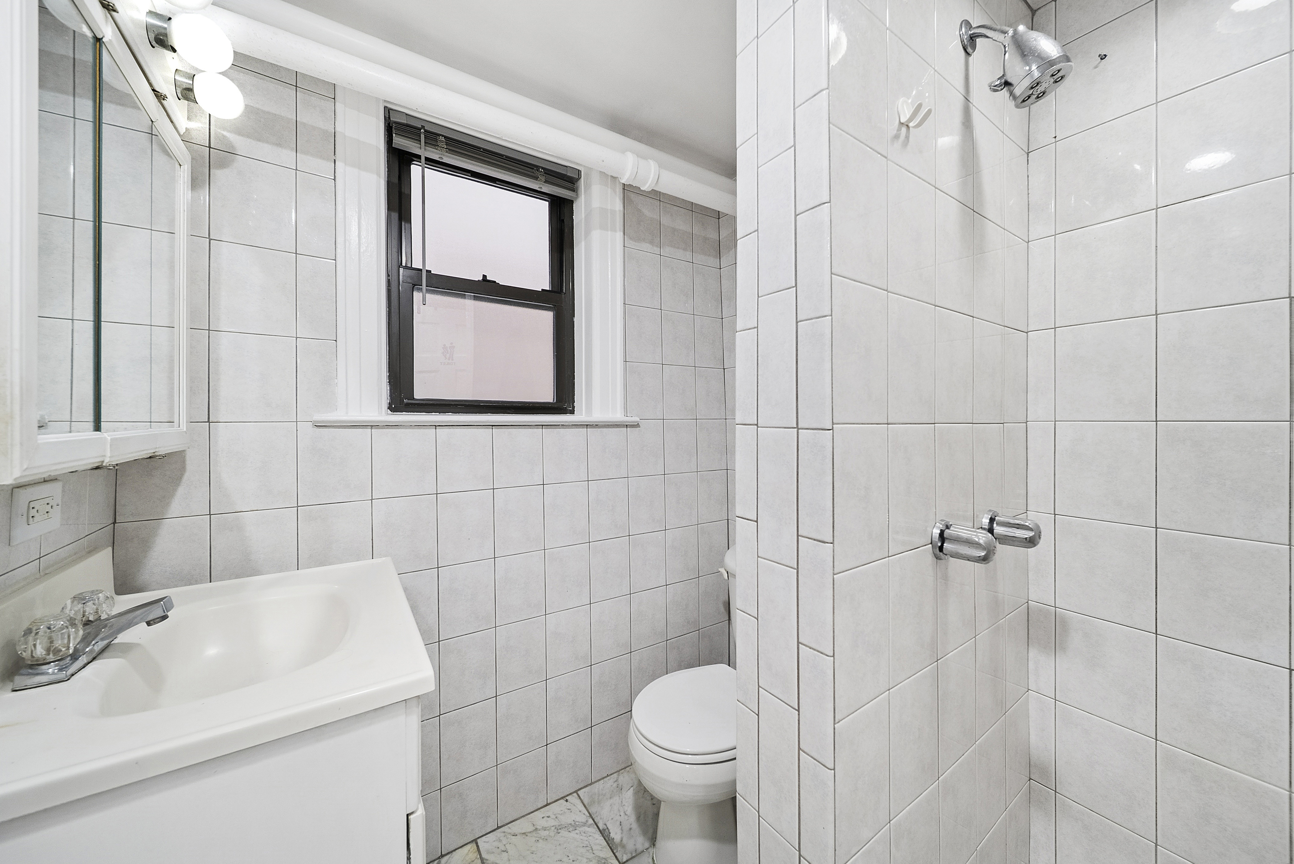 203 Battery Avenue Brooklyn, NY 11209 - Photo 11 of 14 a bathroom with a sink toilet and shower