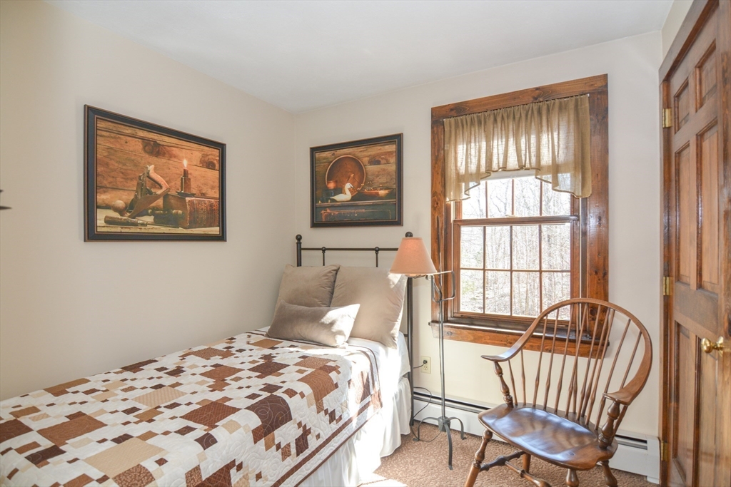 187 Blackstone Street Mendon, MA 01756 - Photo 27 of 42 a bedroom with a bed and a window