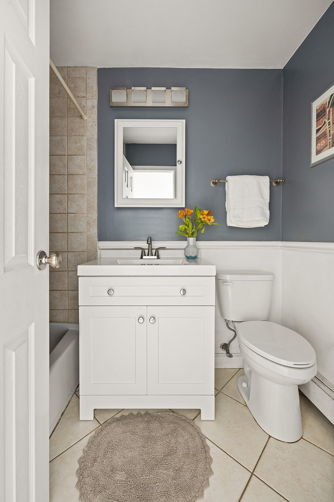 491 12th Street, Unit 2 Brooklyn, NY 11215 - Photo 8 of 21 a bathroom with a toilet sink vanity and mirror