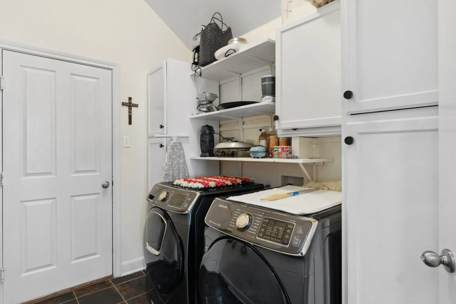 a utility room with dryer and washer