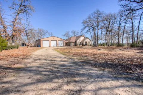 a house with trees in the background