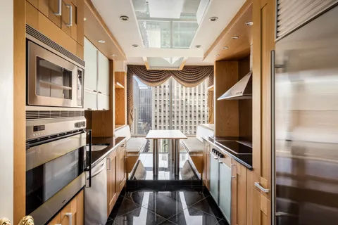 a view of empty room with a fireplace