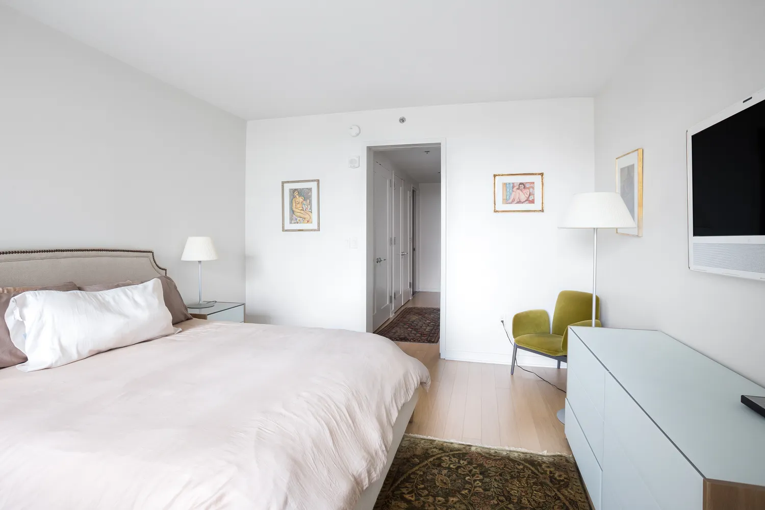 a bedroom with a bed and a couch