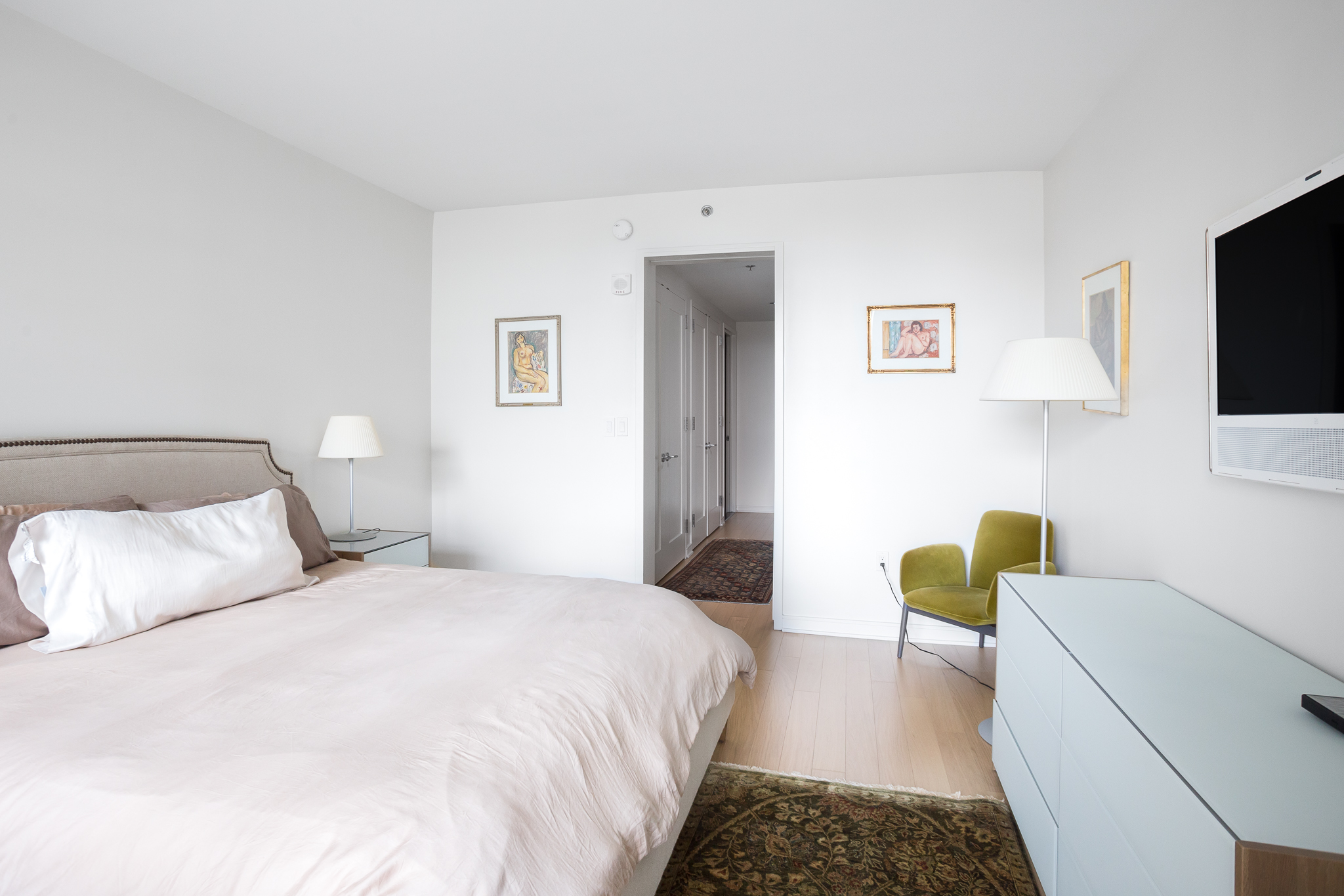 580 Washington Street, Unit 11B Boston, MA 02111 - Photo 5 of 9 a bedroom with a bed and a couch