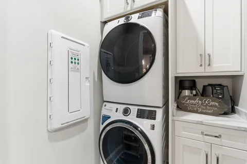 a view of a field with large trees