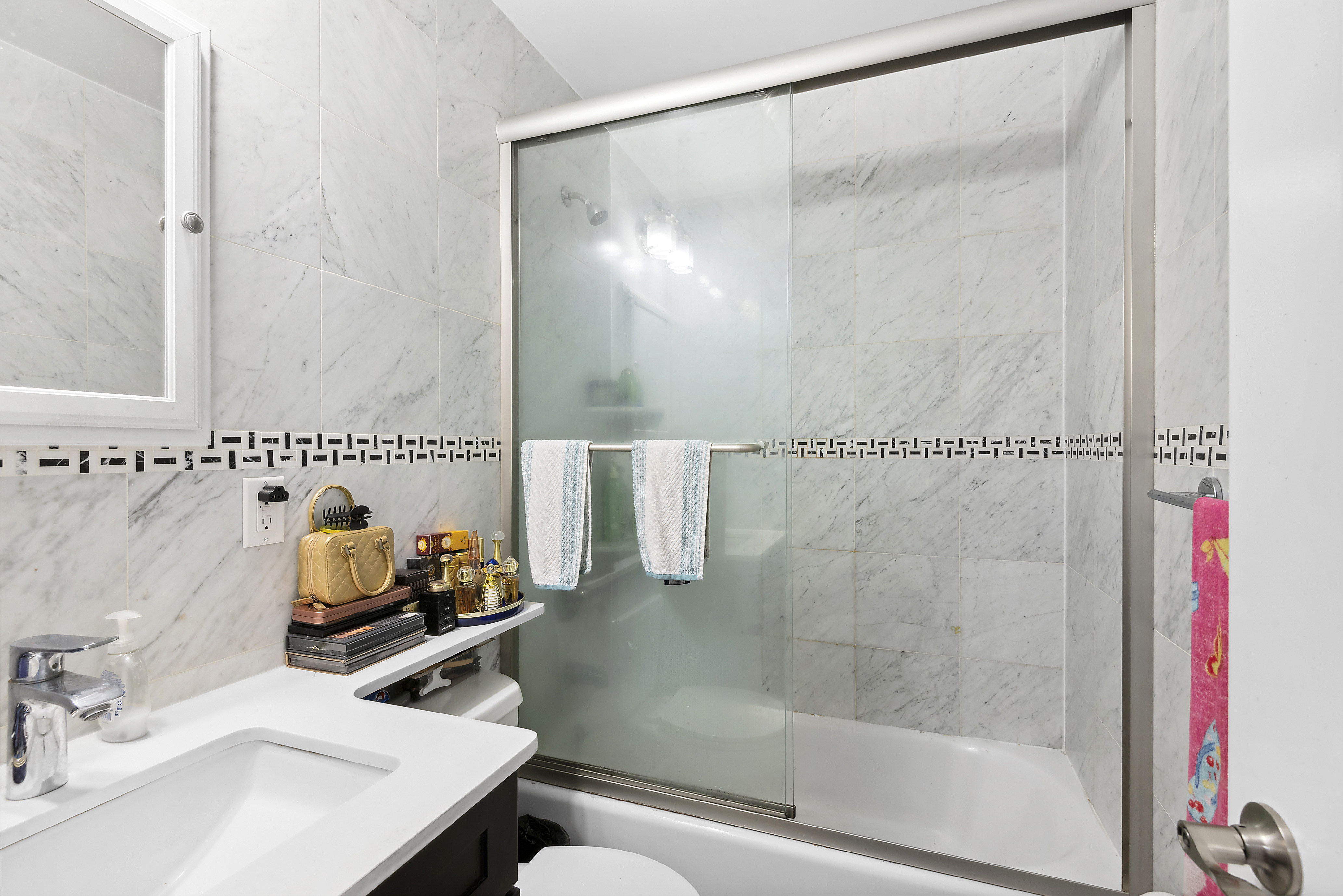397 5th Avenue Brooklyn, NY 11215 - Photo 10 of 14 a bathroom with a sink and a mirror