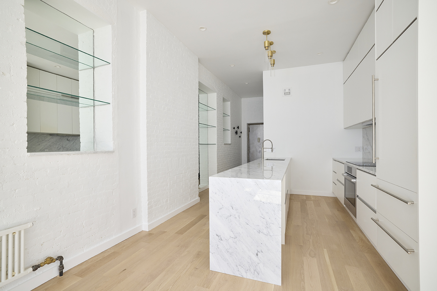 23 East 10th Street, Unit 508 Manhattan, NY 10003 - Photo 13 of 21 a room with cabinets and a rug