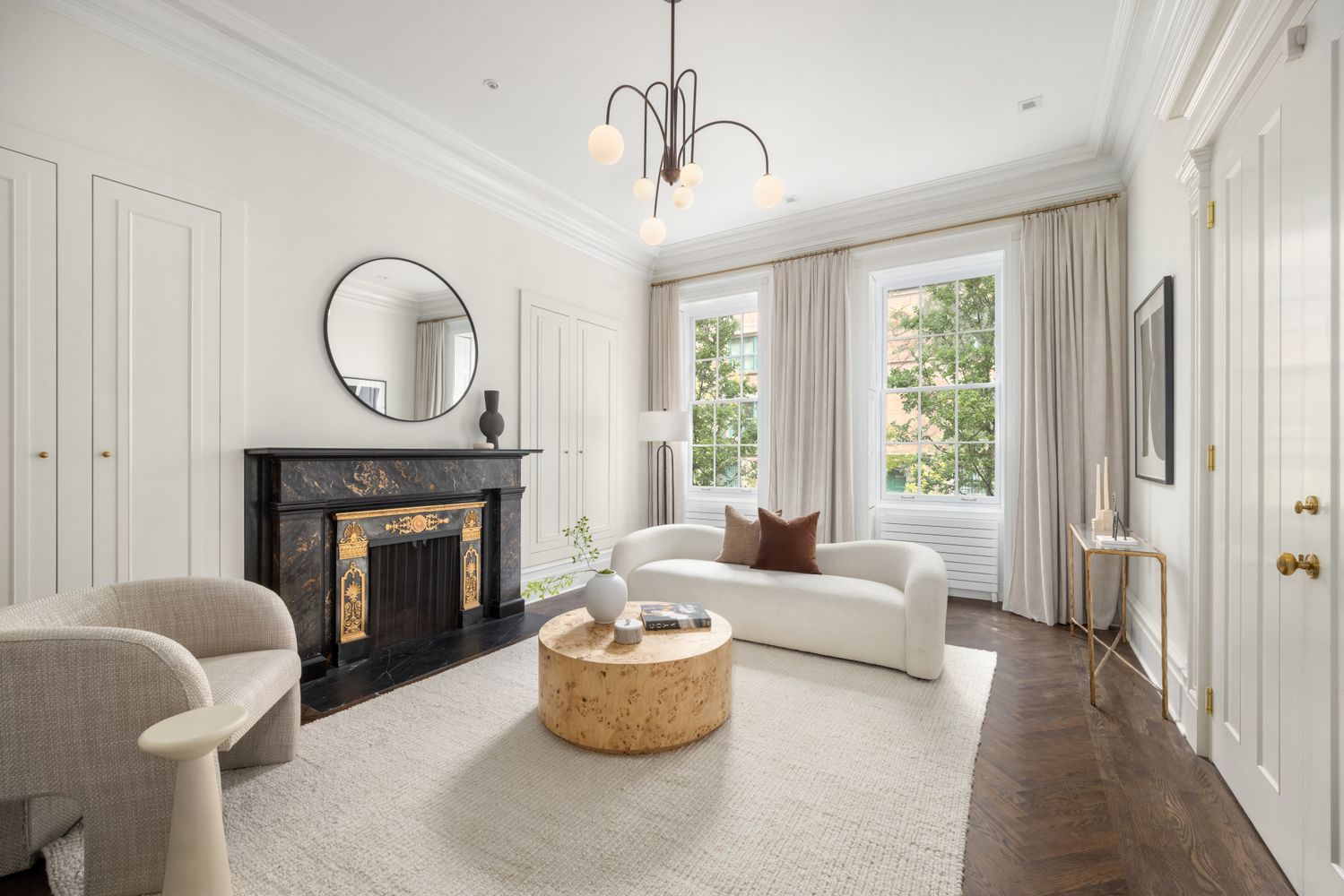 a living room with furniture a window and a fireplace