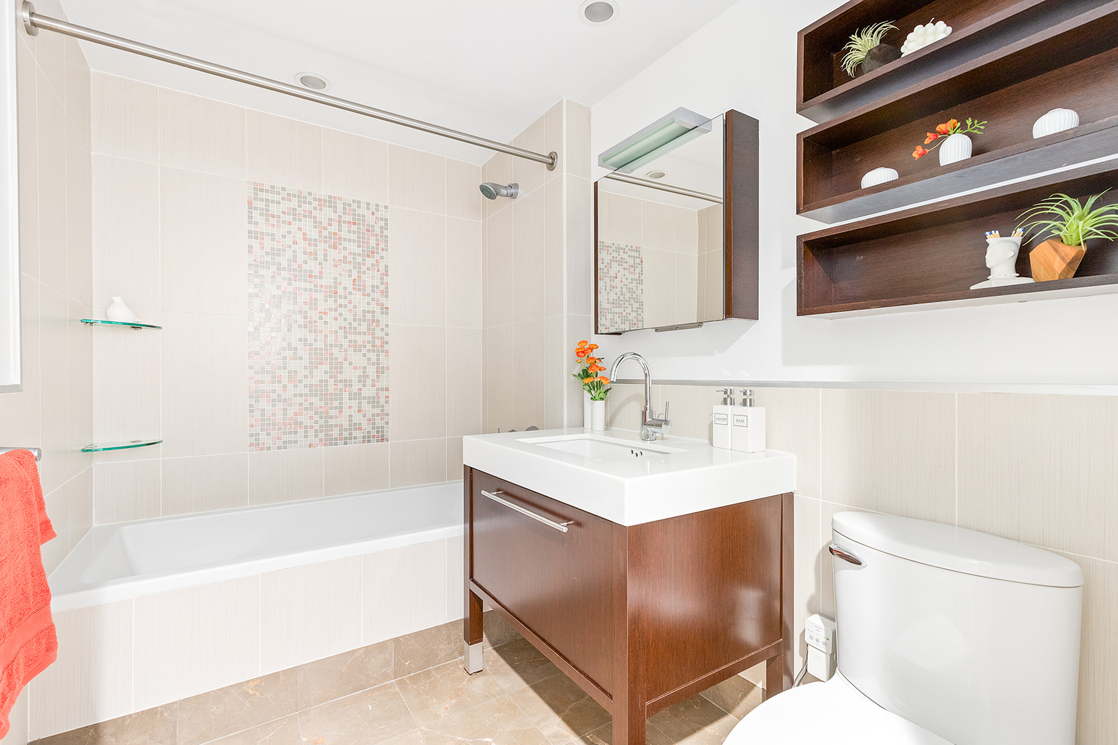 225 East 34th Street, Unit 4H Manhattan, NY 10016 - Photo 6 of 14 a bathroom with a sink a mirror toilet and bathtub