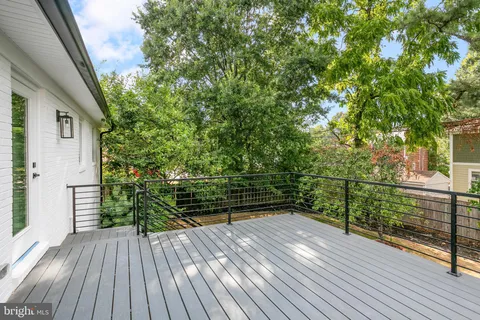 a view of outdoor space with deck and yard
