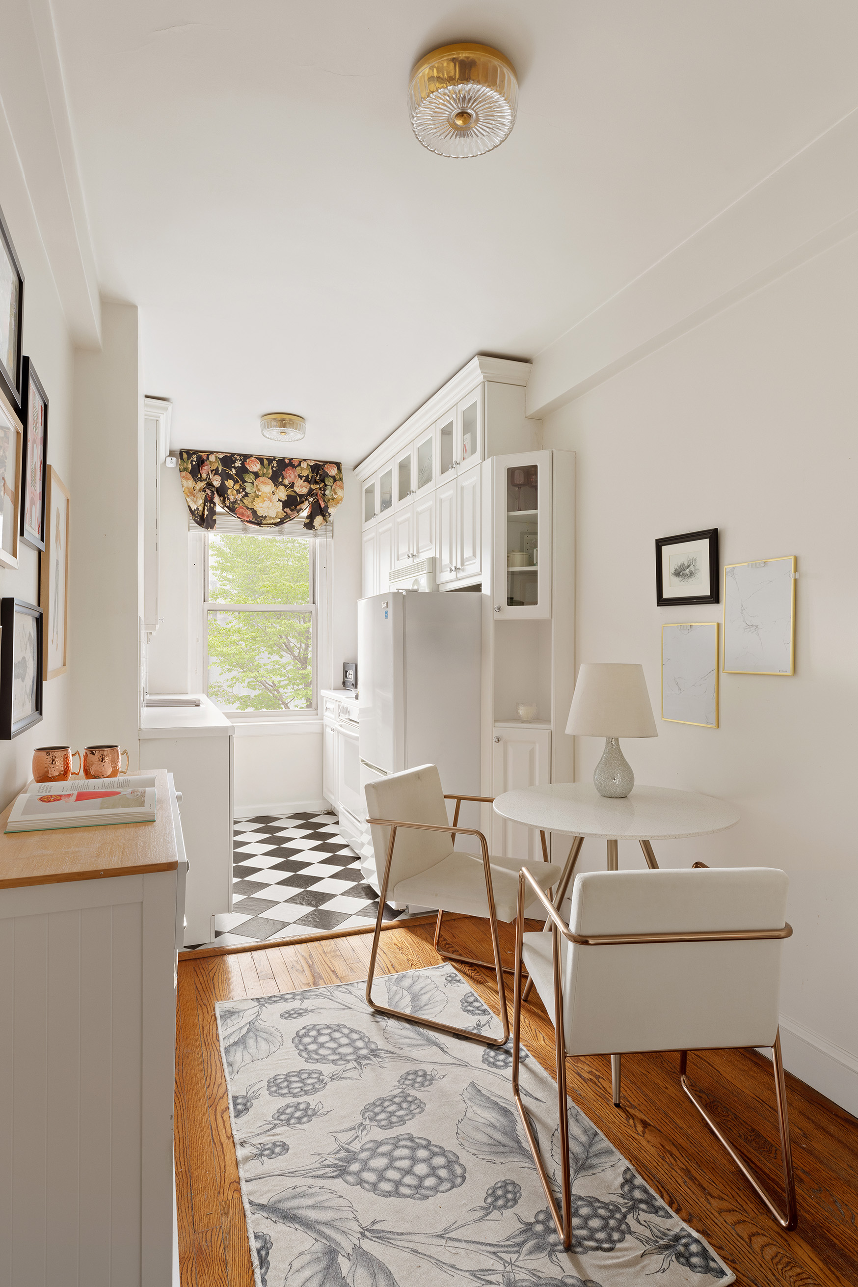 308 East 79th Street, Unit 4K Manhattan, NY 10075 - Photo 4 of 11 a living room with furniture and a table