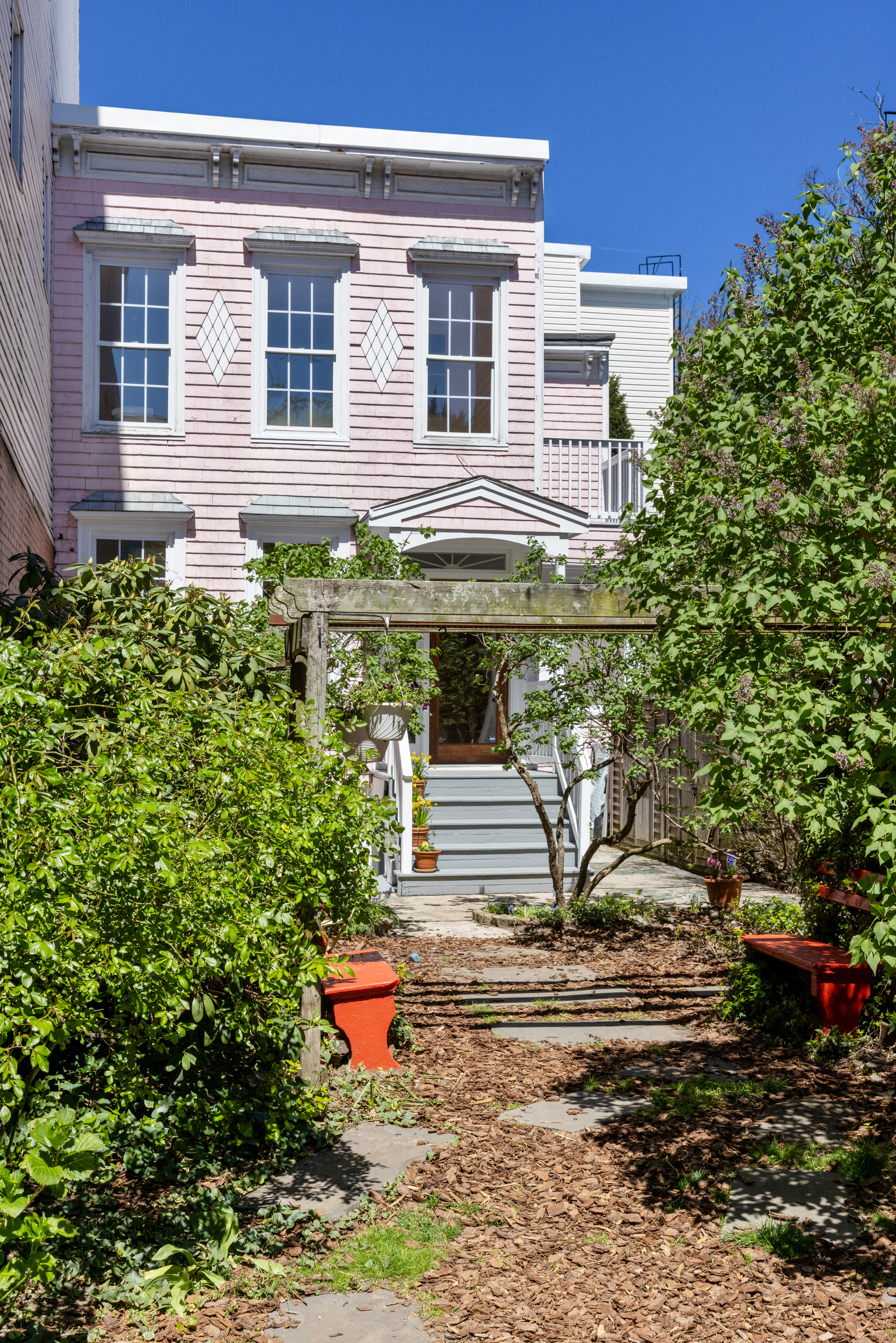 a front view of a house with garden