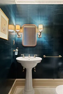a bathroom with a sink and mirror