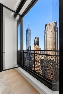 a view of balcony with wooden floor