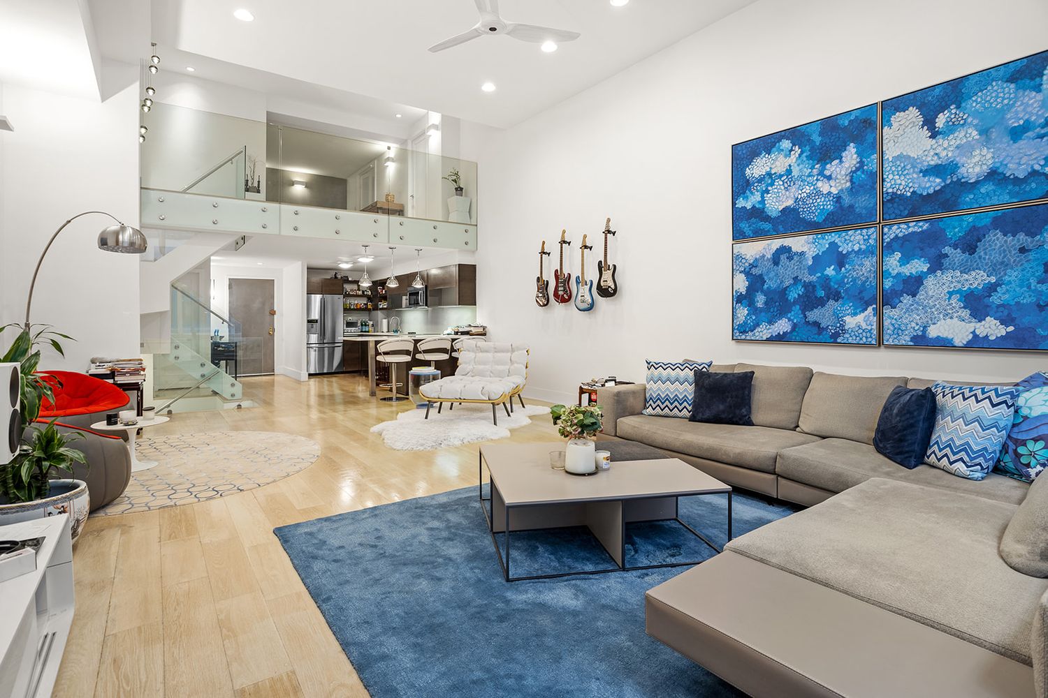 125 East 12th Street, Unit 1E Manhattan, NY 10003 - Photo 1 of 16 a living room with furniture and wooden floor