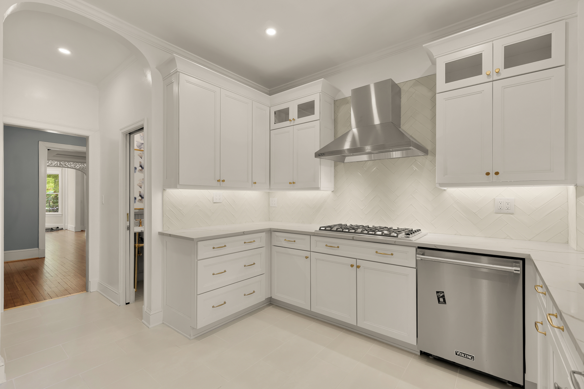 1737 Park Road Northwest Washington, DC 20010 - Photo 11 of 32 a kitchen with white cabinets and appliances