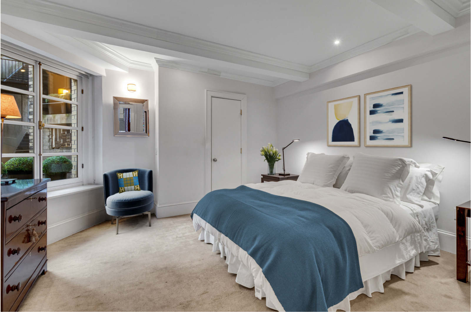 35 East 68th Street, Unit 2A Manhattan, NY 10021 - Photo 8 of 19 a bedroom with a bed and furniture