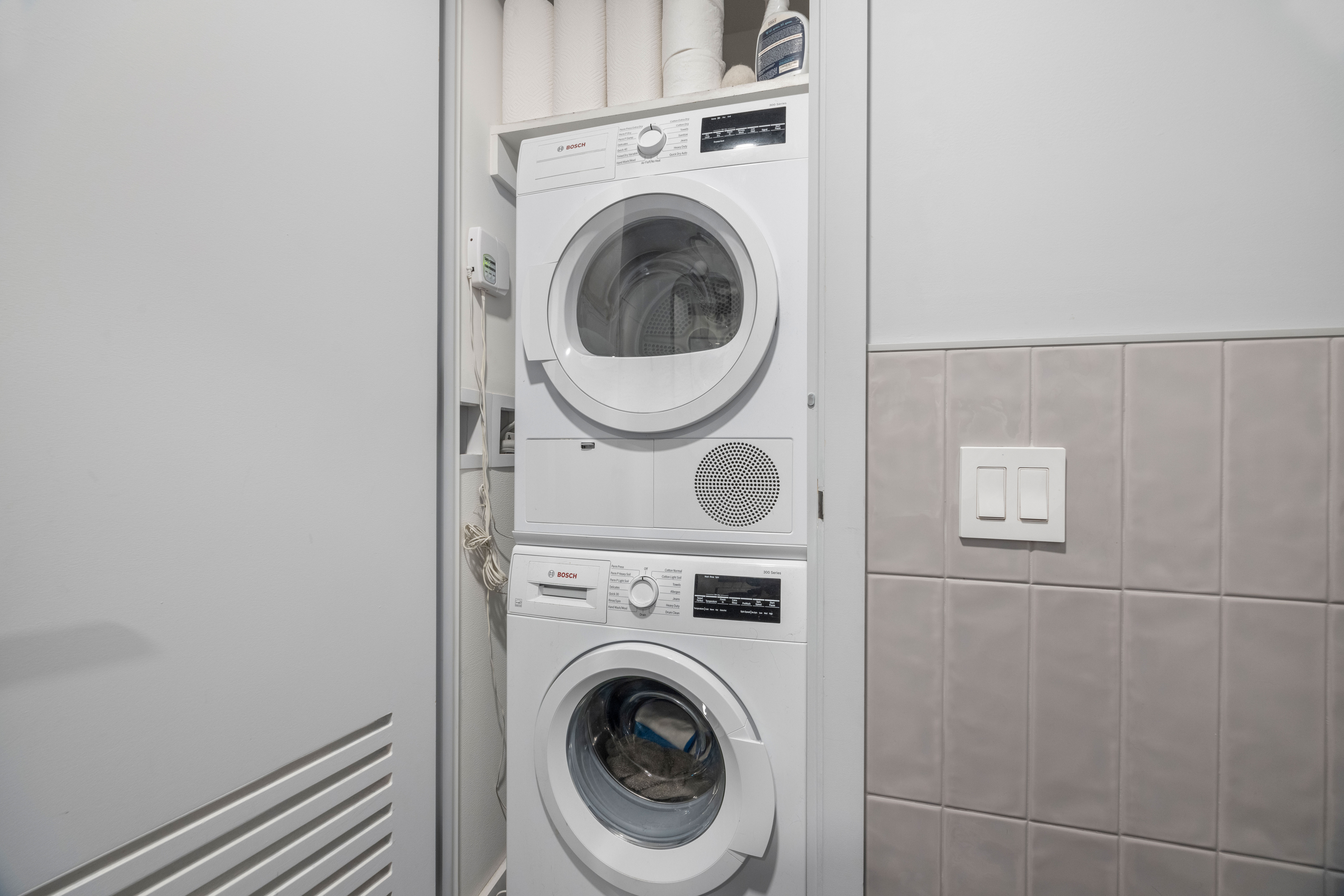 547 West 47th Street, Unit 509 Manhattan, NY 10036 - Photo 13 of 29 a view of a hallway with washer and dryer