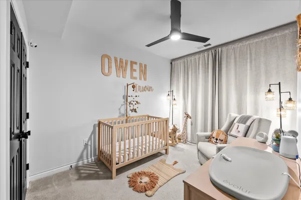 a bedroom with furniture and a window