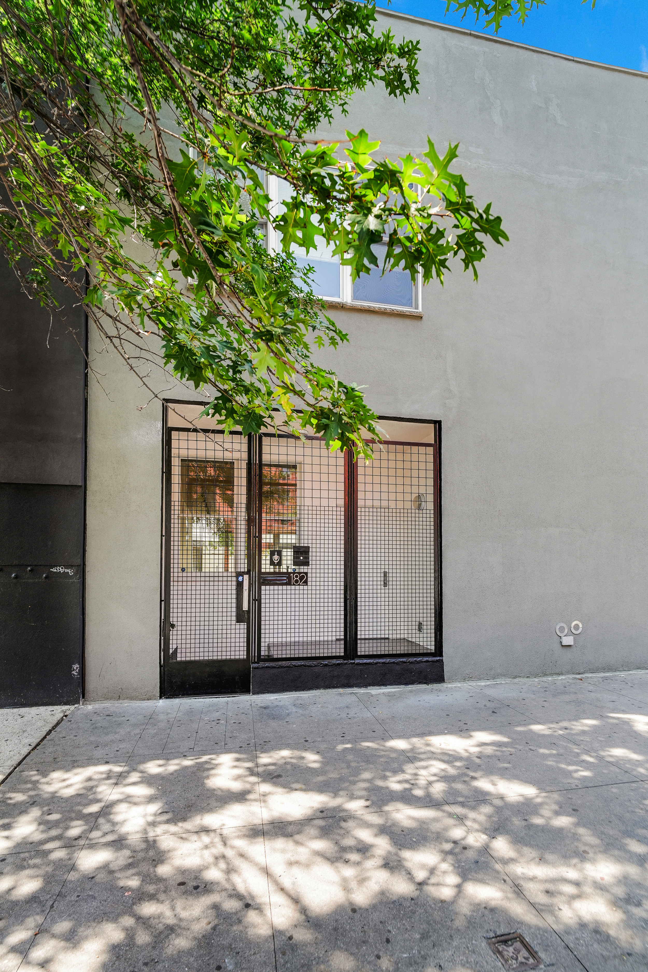182 East 117th Street Manhattan, NY 10035 - Photo 12 of 13 a view of a house with a yard
