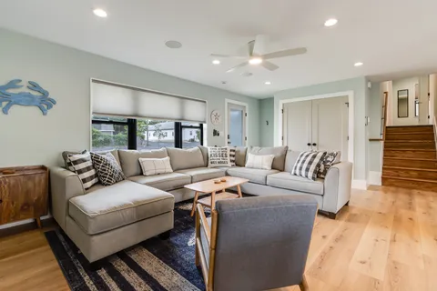 a living room with furniture and a rug