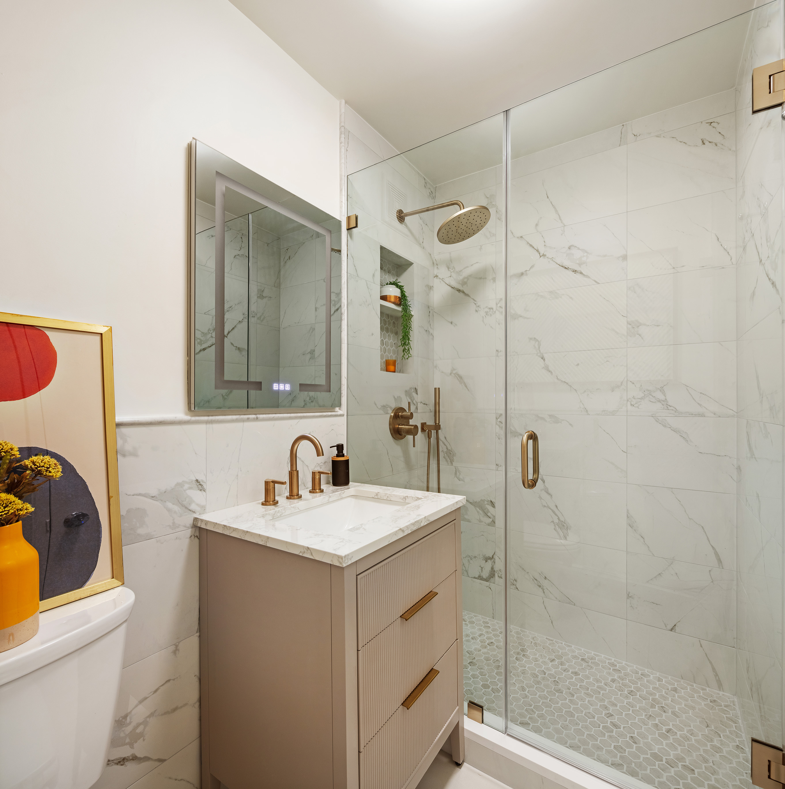 31 Jane Street, Unit 5A Manhattan, NY 10014 - Photo 5 of 13 a bathroom with a sink a toilet and shower