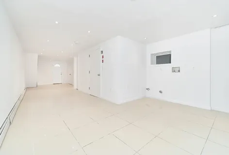 an empty room with white walls