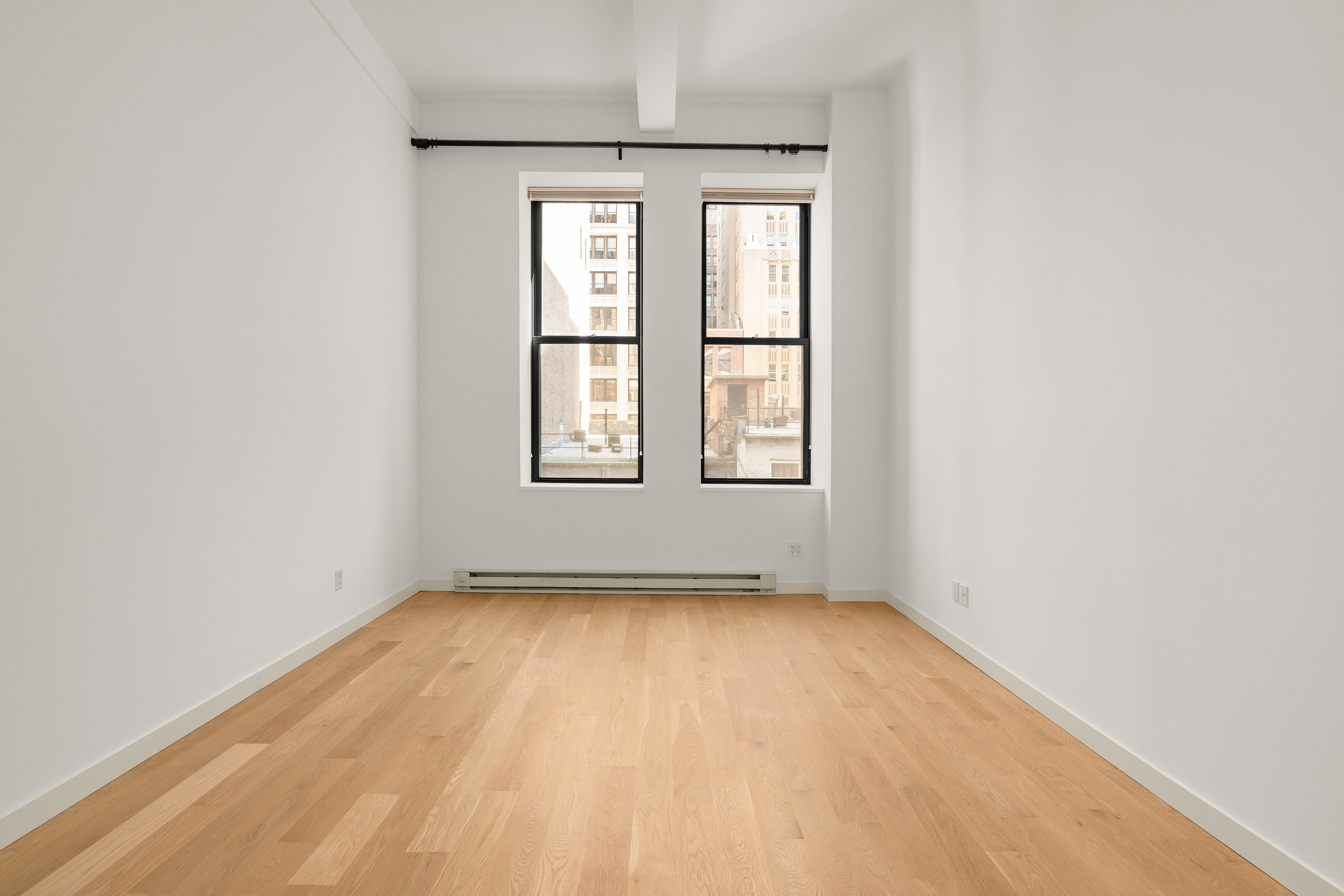 11 East 36th Street, Unit 503 Manhattan, NY 10016 - Photo 4 of 17 an empty room with a window