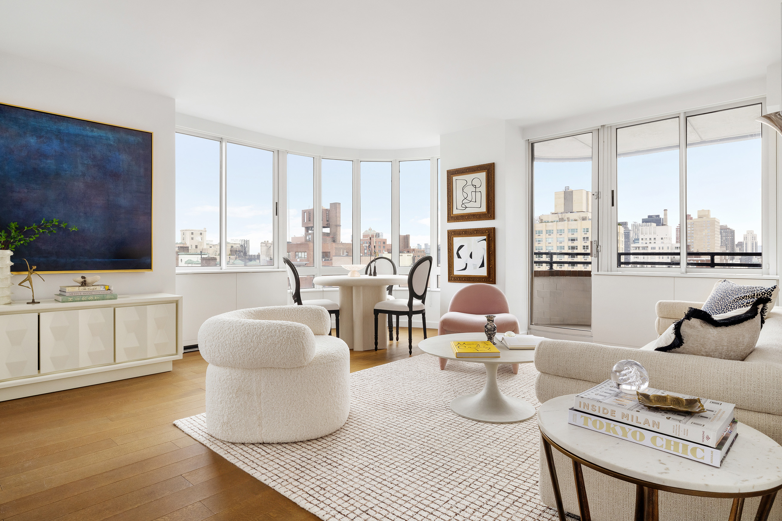 455 East 86th Street, Unit 20E Manhattan, NY 10028 - Photo 2 of 14 a living room with furniture and a flat screen tv