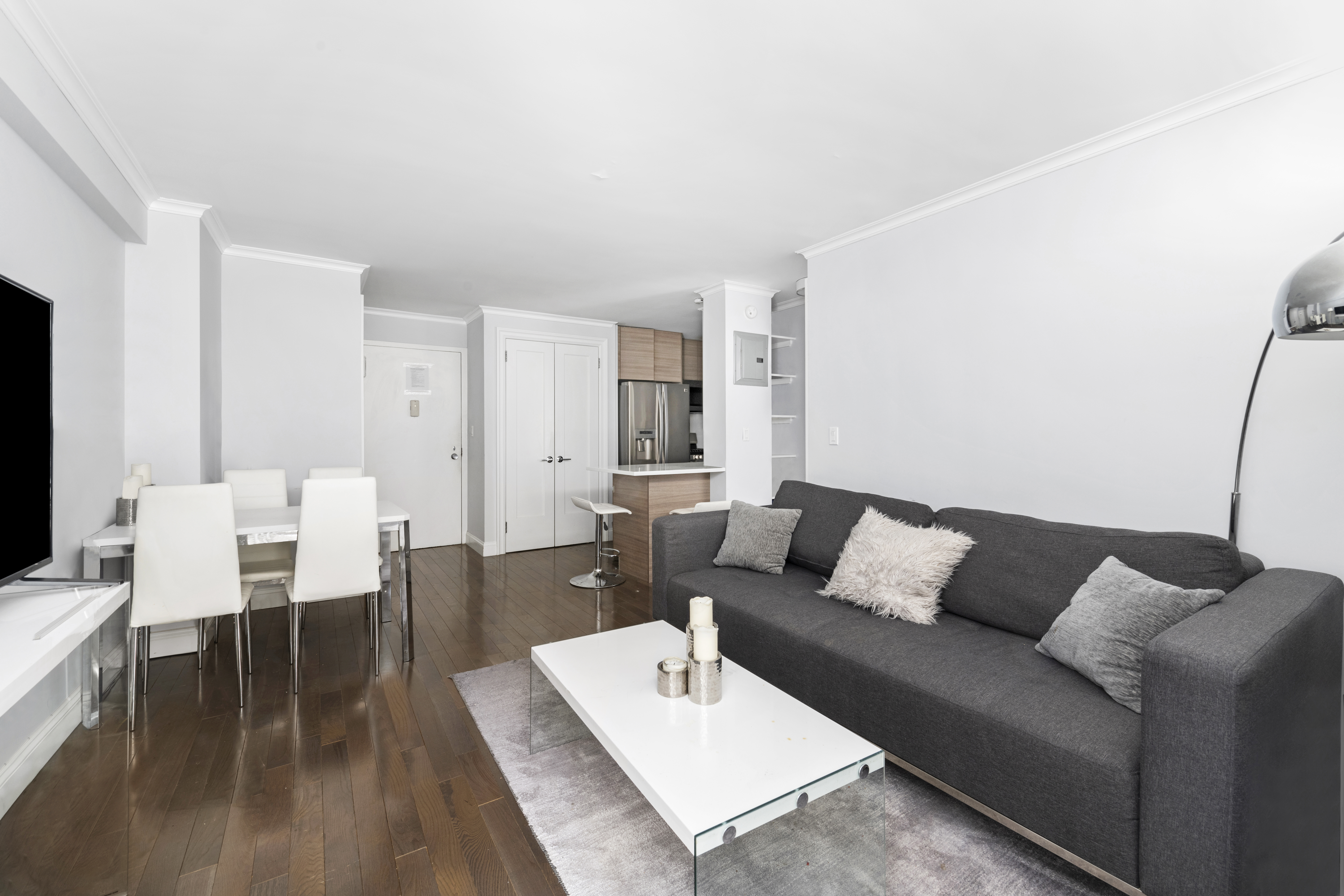 333 East 34th Street, Unit 10H Manhattan, NY 10016 - Photo 7 of 16 a living room with furniture and a couch