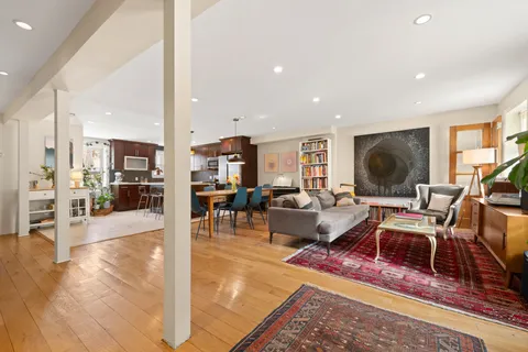 a living room with fireplace furniture and a flat screen tv