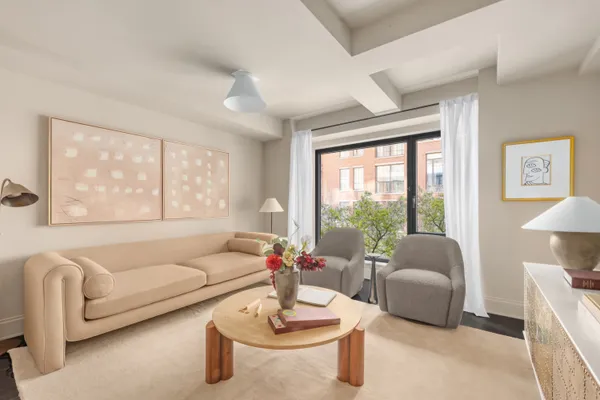 a bed room with a bed and a chair