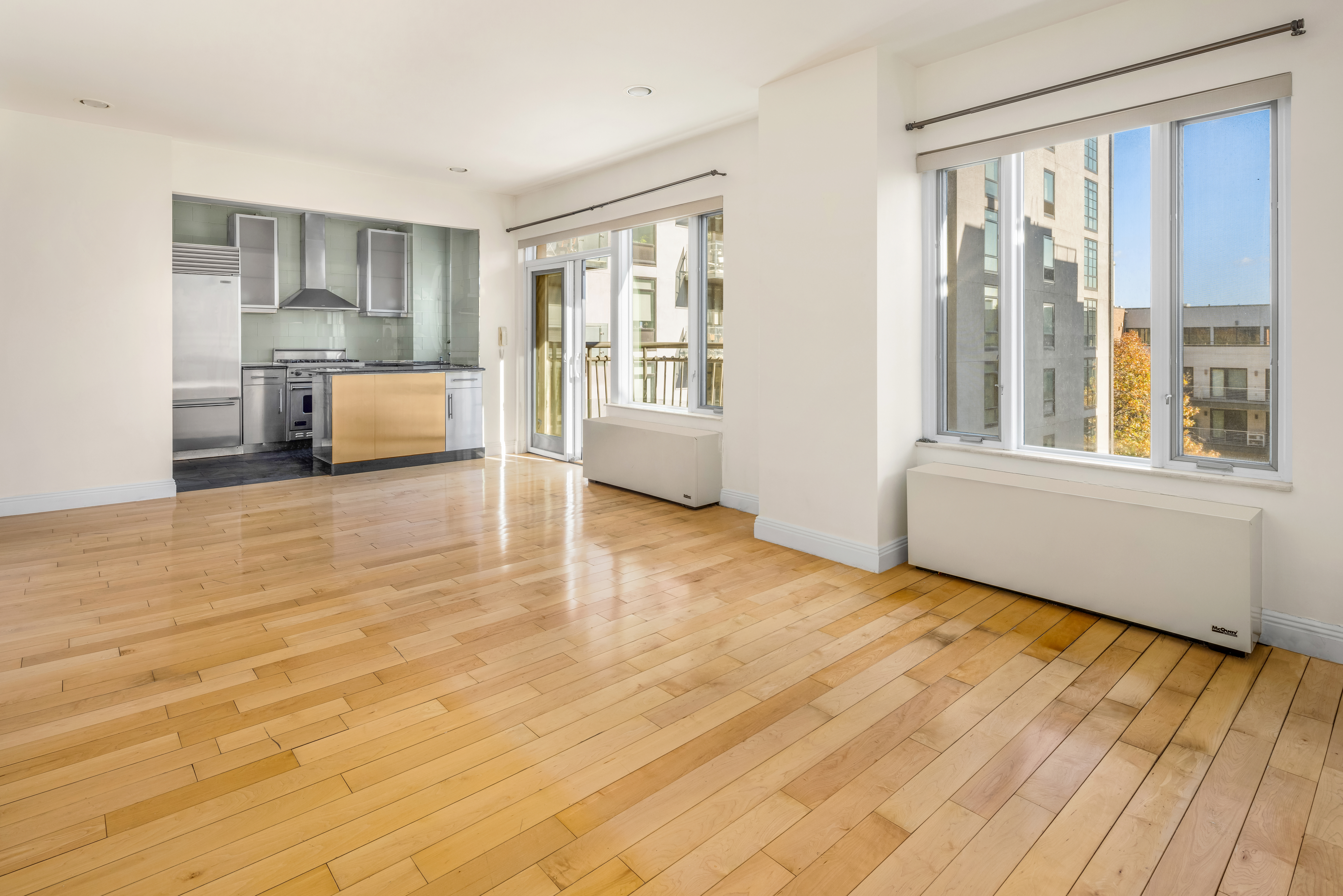 189 Bridge Street, Unit 3A Brooklyn, NY 11201 - Photo 4 of 19 a view of a kitchen with furniture and wooden floor
