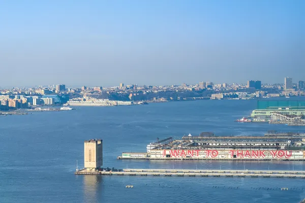 a view of a water with a large mountain view