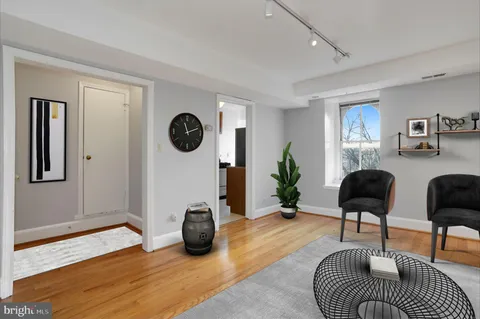 a view of a livingroom with furniture and a window