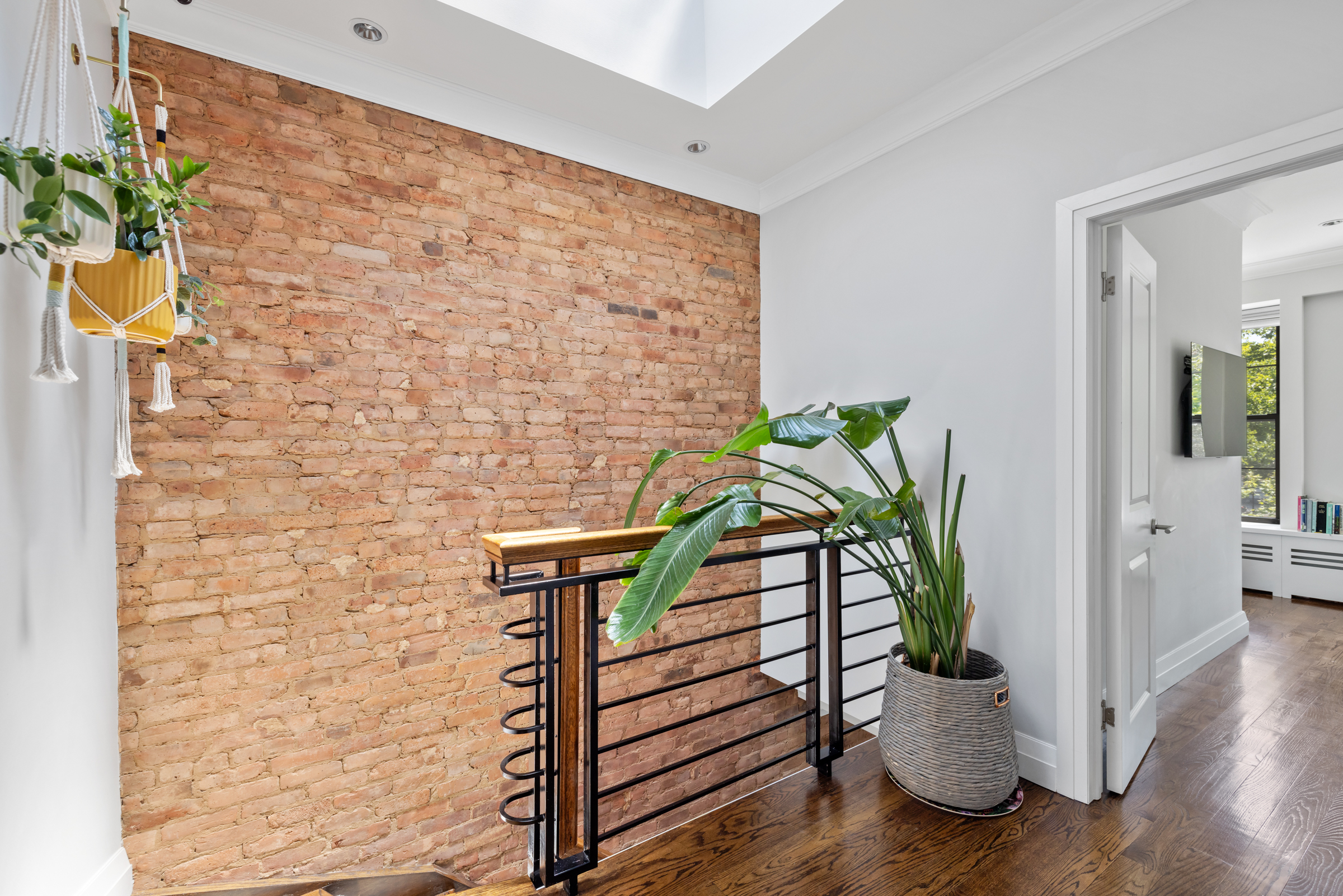 439 A Monroe Street Brooklyn, NY 11221 - Photo 9 of 29 a potted plant sitting on a wooden floor