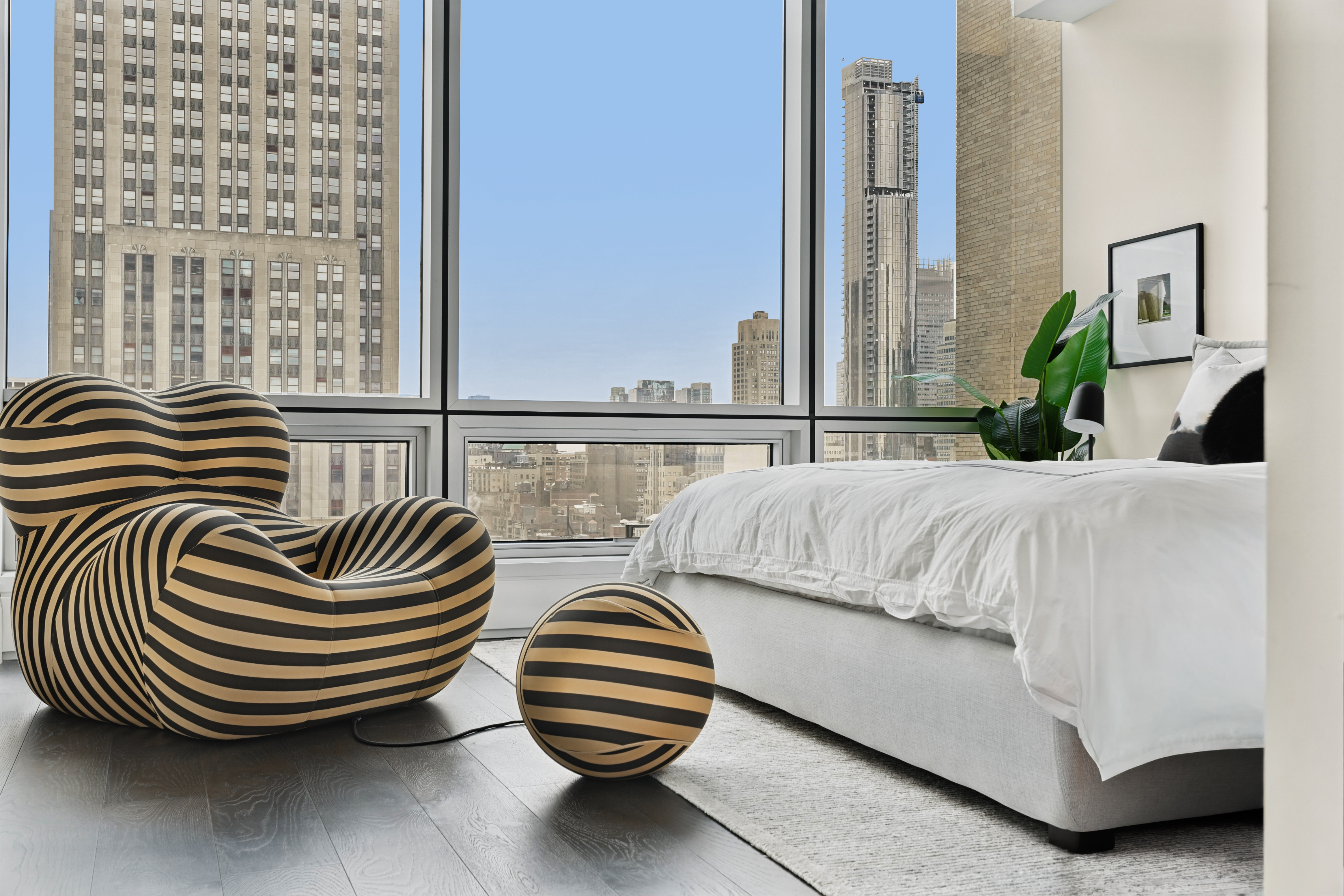 172 Madison Avenue, Unit 24B Manhattan, NY 10016 - Photo 5 of 16 a bedroom with bed and a balcony