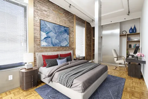 a bedroom with a bed and wooden floor