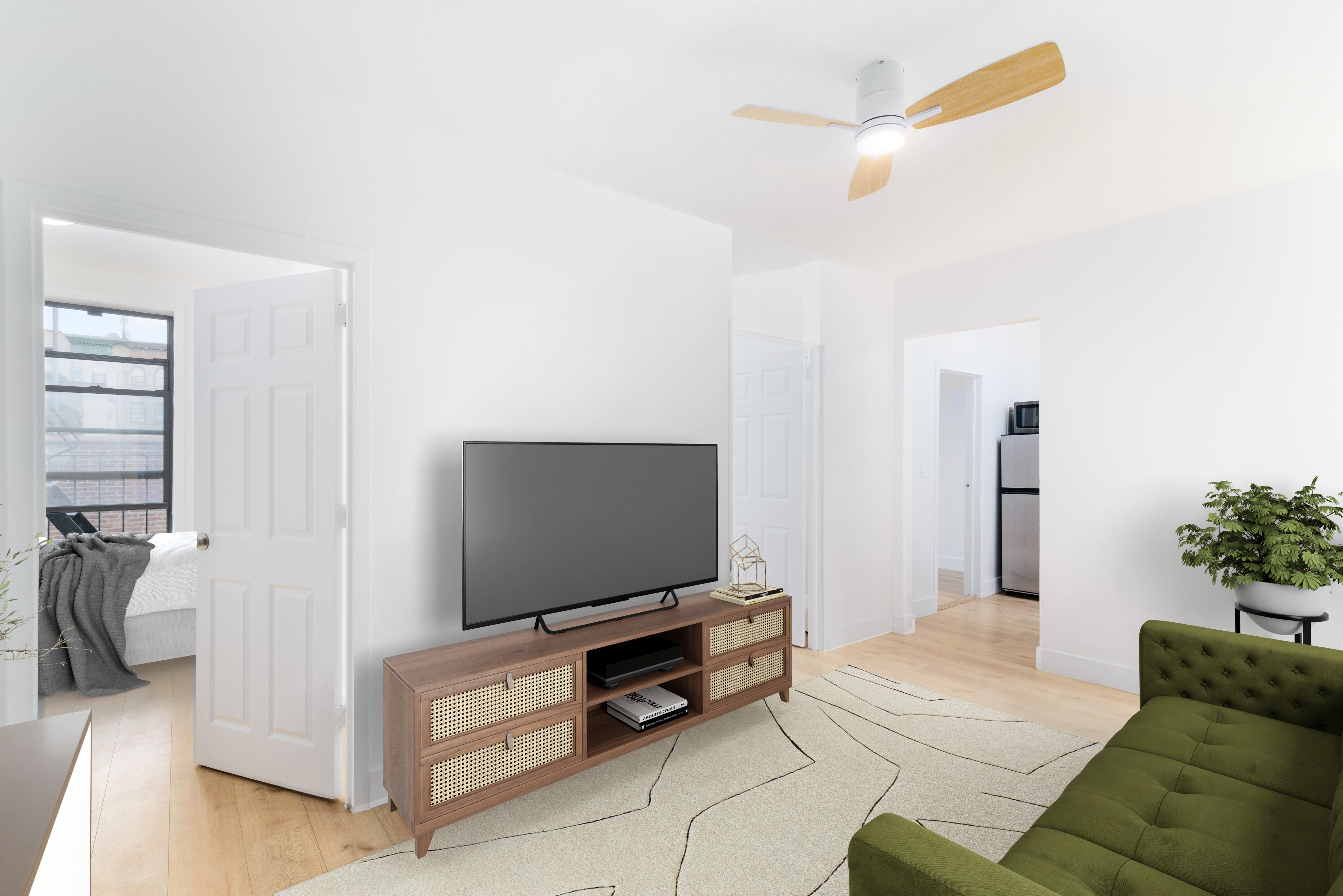 517 West 144th Street, Unit 9 Manhattan, NY 10031 - Photo 16 of 22 a living room with furniture and a flat screen tv