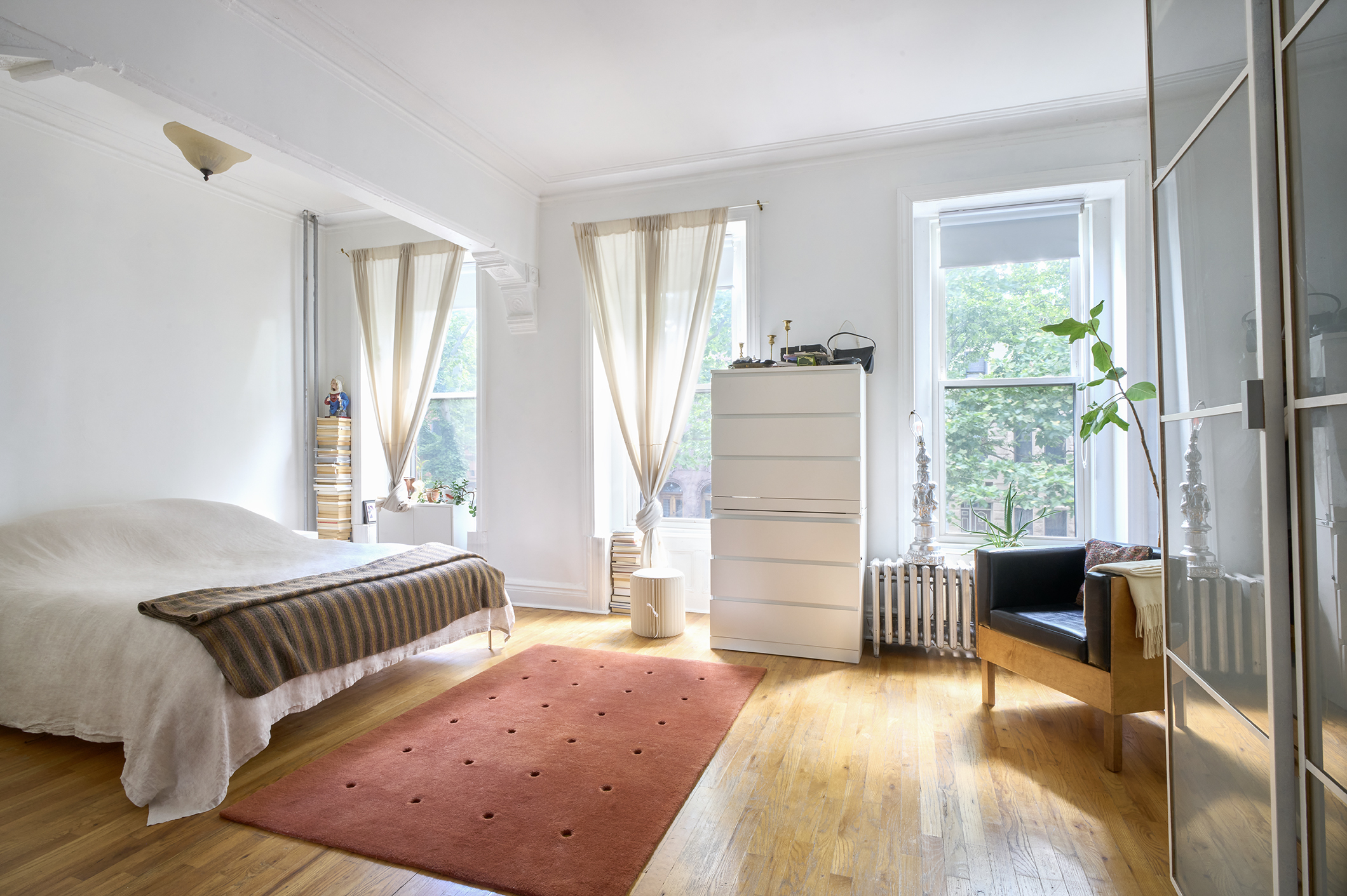 276 Stuyvesant Avenue, Unit 2 Brooklyn, NY 11221 - Photo 3 of 11 a bedroom with furniture and wooden floor