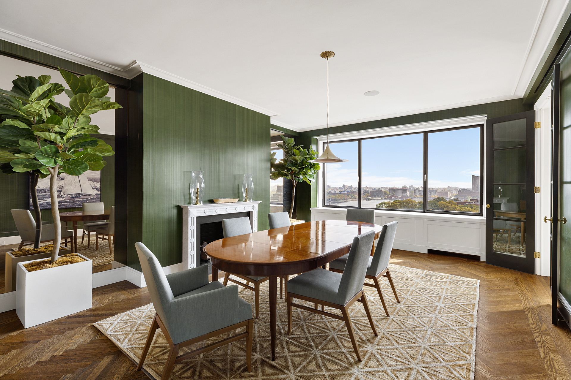 10 Gracie Square, Unit 8D Manhattan, NY 10028 - Photo 7 of 20 a dining room with furniture a chandelier and a rug