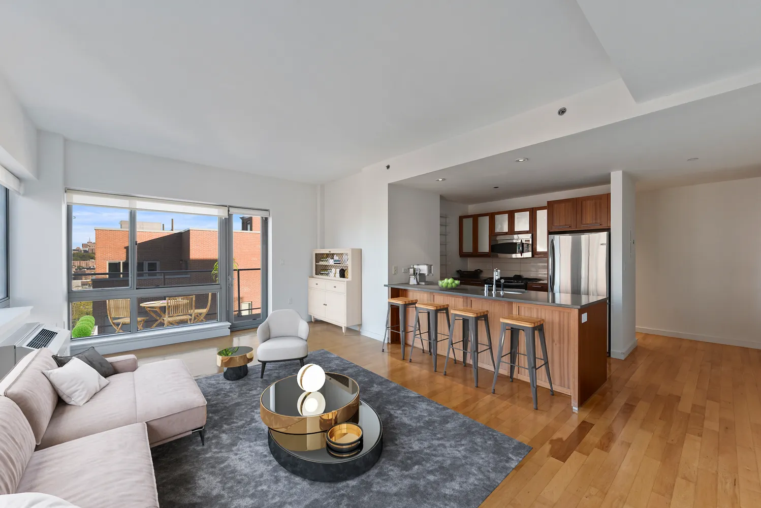 a living room with furniture and a wooden floor