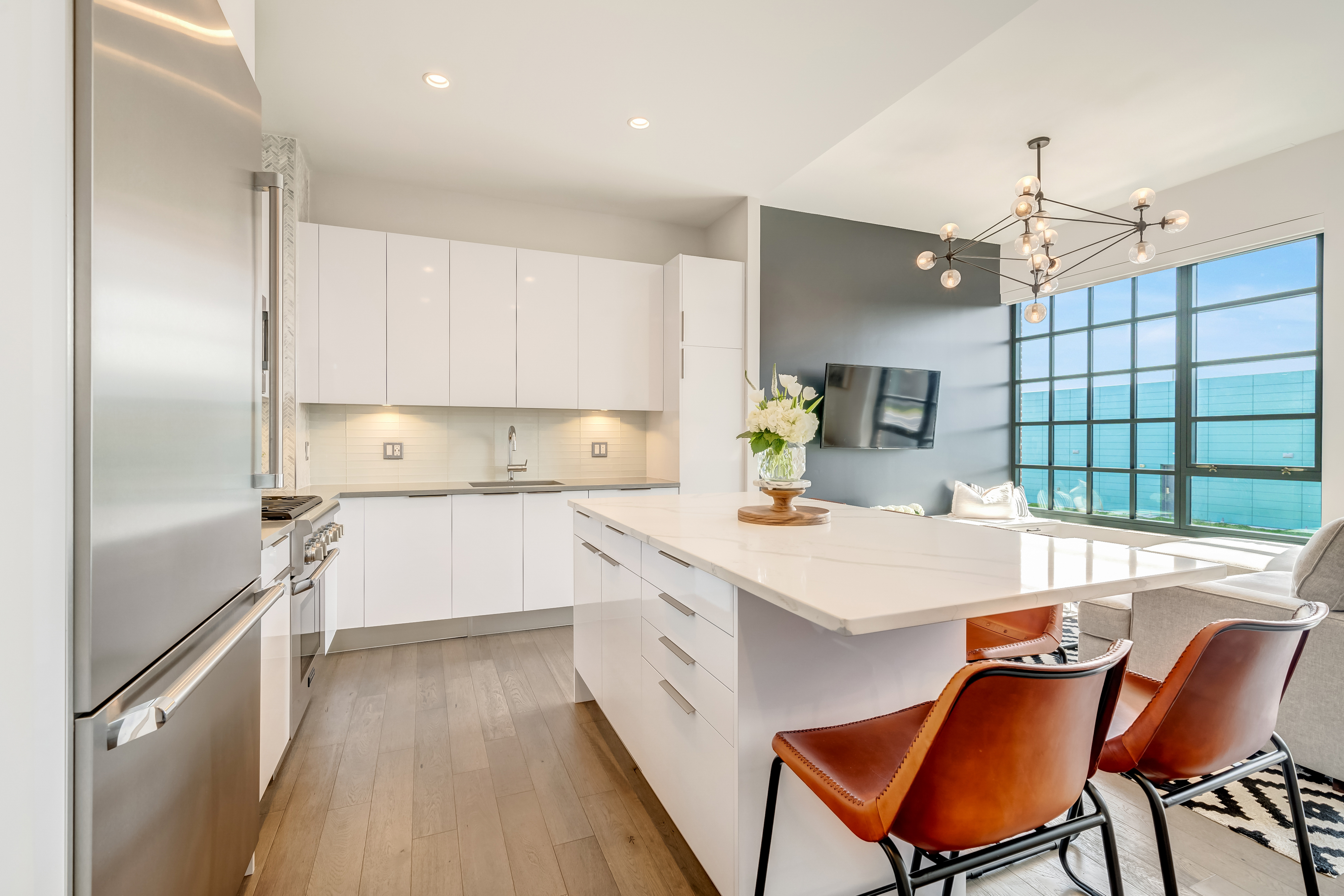 45 Sutton Square Southwest, Unit PH10 Washington, DC 20024 - Photo 17 of 44 a large white kitchen with a window