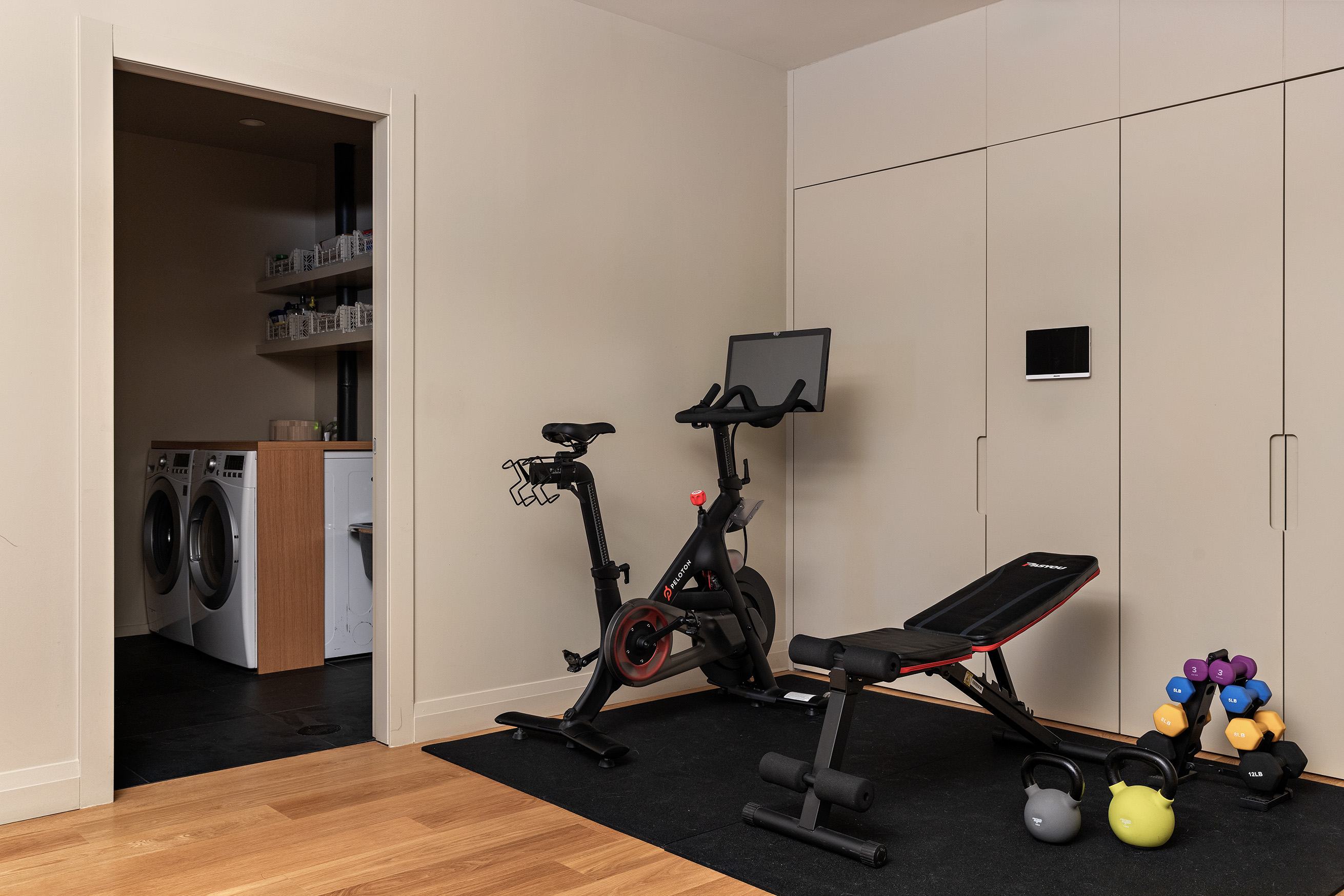 54 MacDougal Street, Unit 1 Manhattan, NY 10012 - Photo 21 of 23 a room with gym equipment and wooden floor
